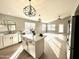 Open concept kitchen with island and stainless steel appliances at 9829 E Onza Ave, Mesa, AZ 85212