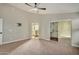 Main bedroom with mirrored closet and access to the bathroom at 9829 E Onza Ave, Mesa, AZ 85212