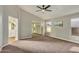 Spacious main bedroom with mirrored closet doors and neutral carpeting at 9829 E Onza Ave, Mesa, AZ 85212
