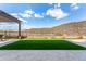 Artificial turf backyard with pergola and mountain views at 11578 W Montansoro Ln, Peoria, AZ 85383