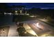 A backyard featuring a modern fire pit and patio seating, perfect for entertaining or relaxing under the stars at 11578 W Montansoro Ln, Peoria, AZ 85383