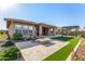 Backyard with firepit, patio, and artificial turf at 11578 W Montansoro Ln, Peoria, AZ 85383
