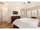 Bright bedroom with king bed and wood floors at 11578 W Montansoro Ln, Peoria, AZ 85383