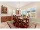 Bright dining room with wood table and chairs at 11578 W Montansoro Ln, Peoria, AZ 85383