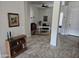 Inviting entryway with tiled floors leading to a bright home office and a view of the front door at 11578 W Montansoro Ln, Peoria, AZ 85383