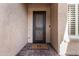 Front entry with security door and decorative doormat at 11578 W Montansoro Ln, Peoria, AZ 85383