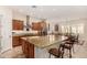 Island kitchen with granite countertops and stainless steel appliances at 11578 W Montansoro Ln, Peoria, AZ 85383
