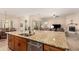 Island kitchen with granite countertops and stainless steel appliances at 11578 W Montansoro Ln, Peoria, AZ 85383