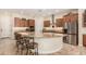 Large kitchen with curved island, granite countertops at 11578 W Montansoro Ln, Peoria, AZ 85383
