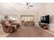 Bright and airy living room with large windows and view to backyard at 11578 W Montansoro Ln, Peoria, AZ 85383