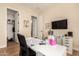 Spacious home office with built-in shelving and large workspace at 11578 W Montansoro Ln, Peoria, AZ 85383