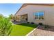 House exterior and grassy backyard at 1180 E Ridgerock St, Casa Grande, AZ 85122