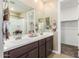 Modern bathroom with double sinks, and a walk-in closet at 1180 E Ridgerock St, Casa Grande, AZ 85122