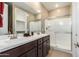 Clean bathroom with double vanity and walk-in shower at 1180 E Ridgerock St, Casa Grande, AZ 85122