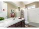 Bathroom with a bathtub, double vanity, and window at 1180 E Ridgerock St, Casa Grande, AZ 85122