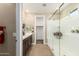 Elegant bathroom with double vanity, large shower, and linen closet at 1180 E Ridgerock St, Casa Grande, AZ 85122
