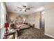 Relaxing bedroom with ceiling fan and large bed at 1180 E Ridgerock St, Casa Grande, AZ 85122