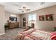 Comfortable bedroom with large window and ceiling fan at 1180 E Ridgerock St, Casa Grande, AZ 85122