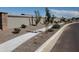 Landscaped front yard with gravel, walkway, and new trees at 1180 E Ridgerock St, Casa Grande, AZ 85122
