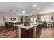 Open concept kitchen with island and breakfast bar at 1180 E Ridgerock St, Casa Grande, AZ 85122