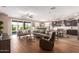 Open living space with hardwood floors and access to backyard at 1180 E Ridgerock St, Casa Grande, AZ 85122