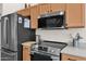 Stainless steel appliances and light wood cabinets highlight this kitchen at 13246 N 31St Way, Phoenix, AZ 85032