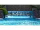 Relaxing pool area with waterfall feature and lounge chairs at 1331 W Baseline Rd # 260, Mesa, AZ 85202
