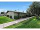 Side view of the house showing landscaping and walkway at 13607 N 111Th Ave, Sun City, AZ 85351