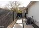 Side yard with flagstone pathway, and a privacy fence at 1413 E Brill St, Phoenix, AZ 85006