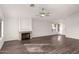 Living room with hardwood floors and a fireplace at 1427 S Western Skies Dr, Gilbert, AZ 85296