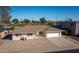 Single-story home with a two-car garage and landscaped front yard at 15013 N Cameo Dr, Sun City, AZ 85351