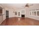 Bright living room with hardwood floors, fireplace, and large windows at 15095 N Thompson Peak Pkwy # 1041, Scottsdale, AZ 85260