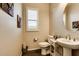 Stylish bathroom with double vanity and a round mirror at 17103 S 182Nd Ln, Goodyear, AZ 85338