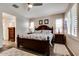 Comfortable bedroom with a wooden bed frame and window shutters at 17103 S 182Nd Ln, Goodyear, AZ 85338