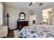 Bright bedroom with dresser and access to bathroom and kitchen at 17103 S 182Nd Ln, Goodyear, AZ 85338