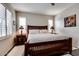 Comfortable bedroom with wood bed frame and window at 17103 S 182Nd Ln, Goodyear, AZ 85338