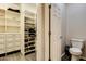 Large walk-in closet with shelving and drawers at 17103 S 182Nd Ln, Goodyear, AZ 85338