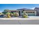 Single-story home with desert landscaping and a two-car garage at 17103 S 182Nd Ln, Goodyear, AZ 85338