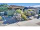 Landscaped front yard with drought-tolerant plants and a walkway at 17103 S 182Nd Ln, Goodyear, AZ 85338