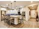 Modern kitchen with granite island, stainless steel appliances, and hardwood floors at 17103 S 182Nd Ln, Goodyear, AZ 85338