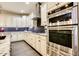 Bright kitchen with stainless steel appliances and granite countertops at 17103 S 182Nd Ln, Goodyear, AZ 85338