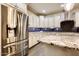Stainless steel appliances and granite countertops in this modern kitchen at 17103 S 182Nd Ln, Goodyear, AZ 85338