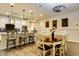 Modern kitchen with white cabinets, an island, and stainless steel appliances at 17103 S 182Nd Ln, Goodyear, AZ 85338