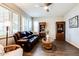 Relaxing living room with leather furniture and wood flooring at 17103 S 182Nd Ln, Goodyear, AZ 85338