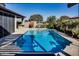 Stunning pool with pergola and lush landscaping at 17103 S 182Nd Ln, Goodyear, AZ 85338