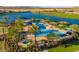 Resort-style pool with palm trees and shade structures at 17103 S 182Nd Ln, Goodyear, AZ 85338