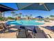 Relaxing pool area with lounge chairs and umbrellas at 17103 S 182Nd Ln, Goodyear, AZ 85338