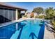 Refreshing blue pool with a spacious patio and outdoor kitchen at 17103 S 182Nd Ln, Goodyear, AZ 85338