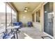 Relaxing screened patio with comfortable seating and ceiling fan at 17103 S 182Nd Ln, Goodyear, AZ 85338