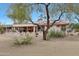 Relaxing backyard oasis with covered patio and desert landscaping at 19808 N Shadow Mountain Dr, Surprise, AZ 85374